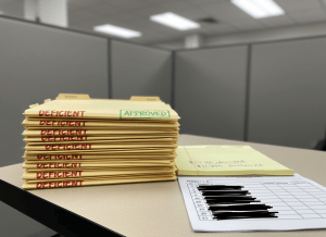 Documentary-style close-up of a government contract negotiation table. On one side, a stack of 12 manila proposal folders — 11 of them have a red "DEFICIENT" stamp across the cover, one has a green "APPROVED" stamp. A legal pad shows a handwritten calculation: "$29.1M identified / $11.7M sustained." Beside it, a spreadsheet printout with rows labeled "Report 4," "Report 6," "Report 10," "Report 11" — the vendor name column is entirely blacked out. The aesthetic is dry and bureaucratic — fluorescent light, government beige and gray. The mood is one of obscured accountability, competent auditing, and incomplete transparency.